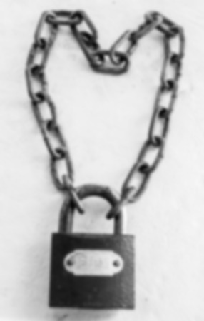Key lock locked with a chain,Image blur styleの写真素材