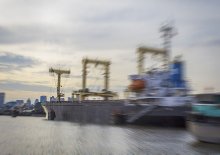 Container ship entering port with sunset time with image zoom styleの写真素材