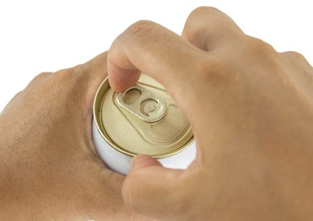 a hand opening  beer can
