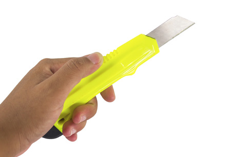 Hand holding cutting knife tool