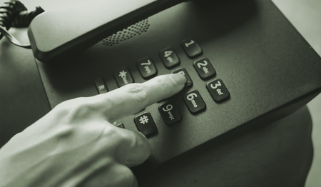 hand presses the button on phone,retro styleの写真素材