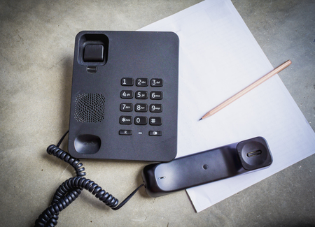 telephone and paper check  messageの写真素材