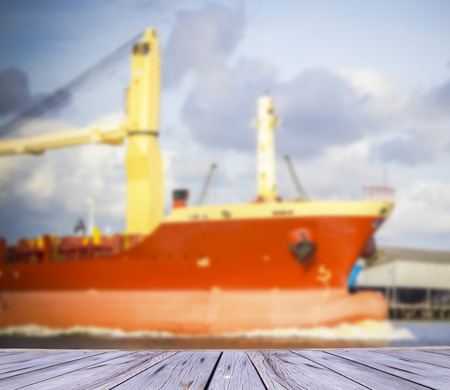container ship entering port on blue sky backgroundの写真素材