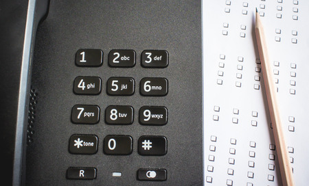 telephone and paper check  messageの写真素材