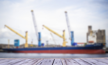 container ship entering port on blue sky backgroundの写真素材