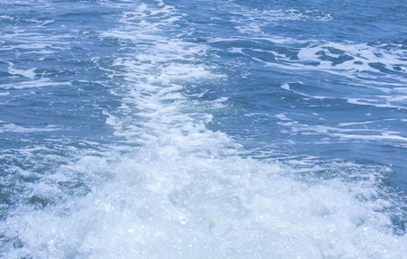 Water is waves by boat .の写真素材