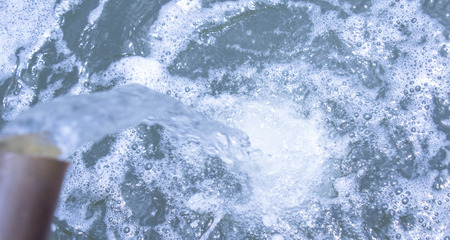 Water flowing from rubber ahose  water.の写真素材