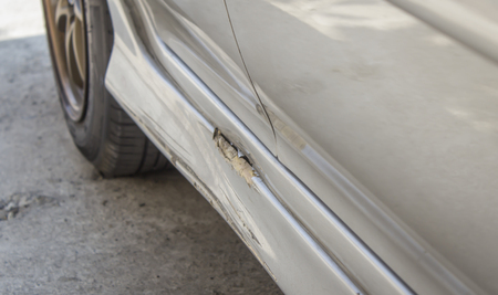 Cracked and peeling paint on an old car backgroundの写真素材