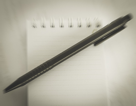 Notebook and pen isolated vintage styleの写真素材