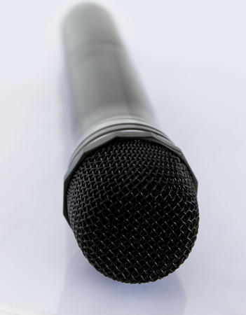 Black microphone on white backgroundの写真素材