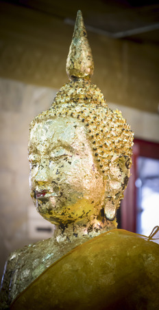 Buddha head gilding with gold leaf.の写真素材
