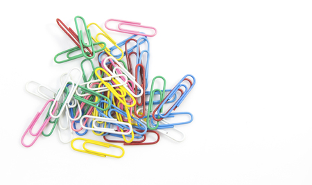 Colorful paper clips for office usage on white backgroundの写真素材