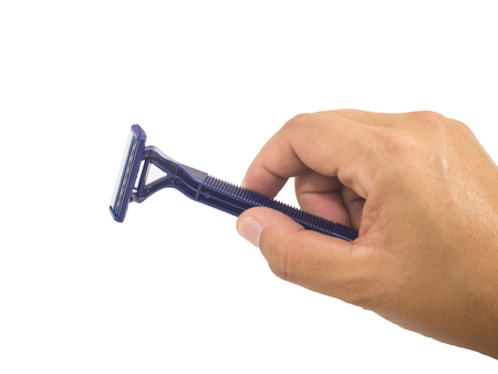 Close up of blue shaver in hand on white backgroundの写真素材