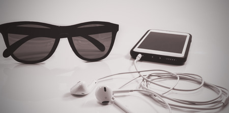 Sunglasses and smartphones on white backgroundの写真素材