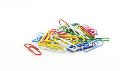 Colorful paper clips for office usage on white backgroundの写真素材