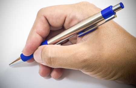 Himan using a calligraphy pen with space to add text on white backgroundの写真素材