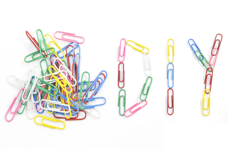 Colorful paper clips for office usage on white backgroundの写真素材