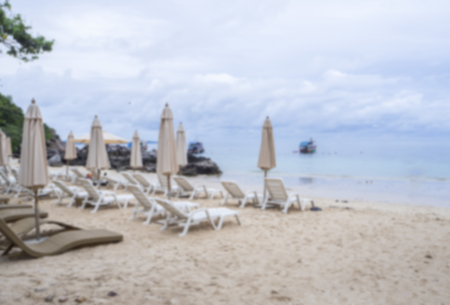 White sunbeds  at the Beach.image bluredの写真素材