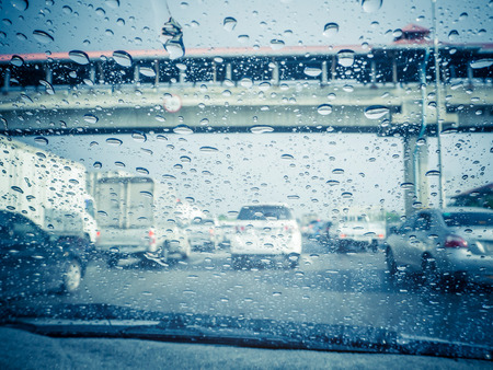 Traffic view from car windscreen in rain.Driving in rain