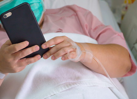 Work out sick,saline solution with smartphone in hand