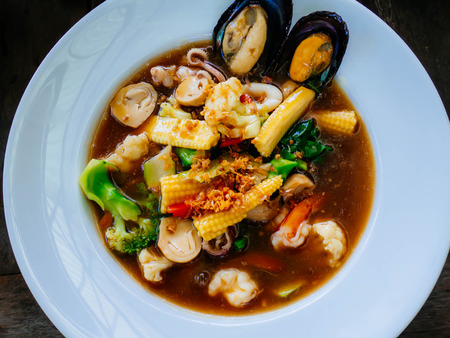 Fried noodle with pork and kale soaked in gravy, Thai Symbolic Food  called  "Rad Na"の写真素材