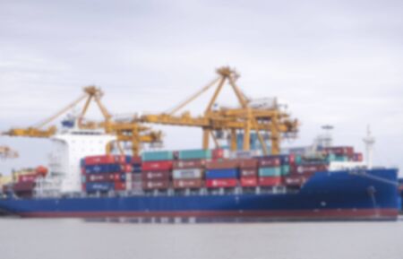 Container ship in port at container terminal , Image blurred styleの写真素材