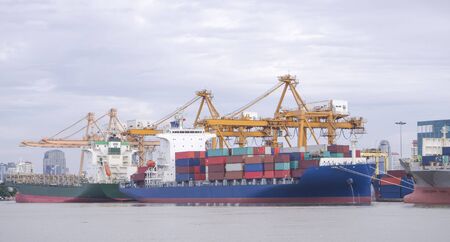 Container ship in port at container terminalの写真素材