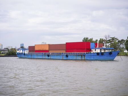 Cargo container ship cruising on the River.の写真素材