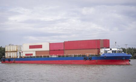 Cargo container ship cruising on the River.の写真素材