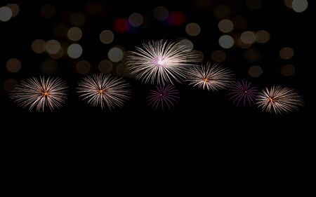 Fireworks and bokeh on black background