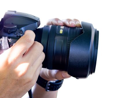 Hands holding the camera on white backgroundの写真素材