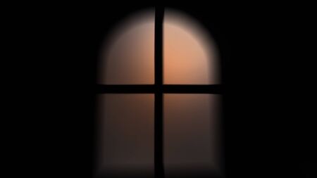 The  orange light  mirror the door in the dark bedroomの写真素材