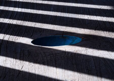 Grungy concrete wall textured background with shadow linesの写真素材