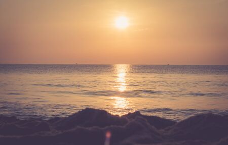 Beautiful sunset landscape at black sea and orange sky の写真素材