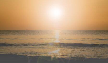 Art Beautiful sunset landscape at black sea and orange skyの写真素材