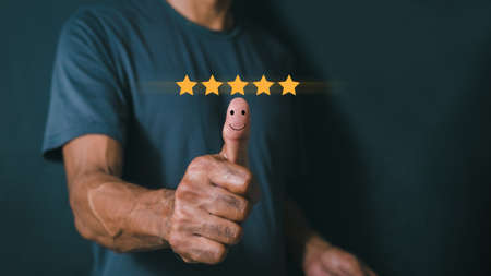 Customer satisfaction concept. Hand with thumb up Positive emotion smiley face icon and five star...