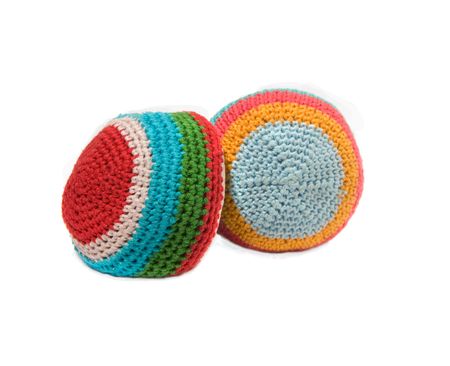 Freestyle Footbag ,Crocheted balls on on white backgroundの写真素材