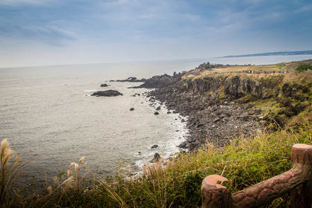 Beautiful landscape view of eopjikoji, located at the end of the eastern shore of Jeju Island. "Seopji" is the old name for the area, and "Koji" is Jeju dialect meaning a sudden bump on land.の写真素材
