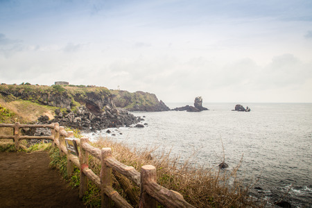Beautiful landscape view of eopjikoji, located at the end of the eastern shore of Jeju Island. "Seopji" is the old name for the area, and "Koji" is Jeju dialect meaning a sudden bump on land.の写真素材