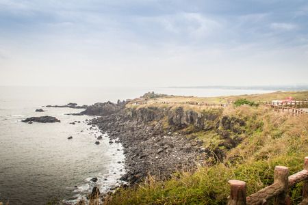 Beautiful landscape view of eopjikoji, located at the end of the eastern shore of Jeju Island. "Seopji" is the old name for the area, and "Koji" is Jeju dialect meaning a sudden bump on land.の写真素材