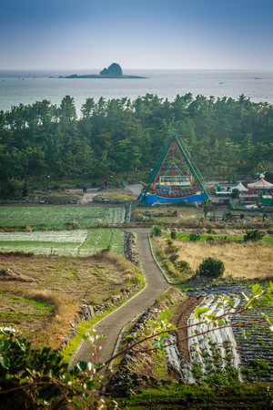 Jeju Island, KOREA - NOVEMBER 12: The tourist visited Sanbanggulsa temple that located on Sanbangsan Mountain. On the way to the cave, with the temple in it you have multiple buildings - 12 NOVEMBER 2016のeditorial素材