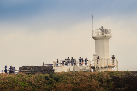 Jeju Island, Korea - November 13, 2016 : The tourist visited Lighthouse, the target of treking in Seopjikoji. Located at the end of the Eastern shore of Jeju island, South Koreaのeditorial素材