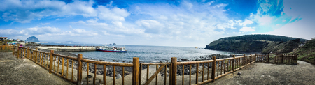 The tourist visited Seongaksan coast, the famous coastal drive with breathtaking scenic views in Jeju islandのeditorial素材