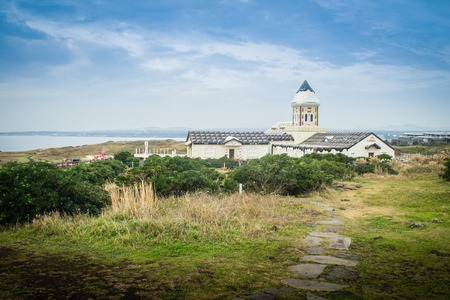 Beautiful Catholic Church at Seopjikoji, located at the end of the eastern shore of Jeju Island. "Seopji" is the old name for the area, and "Koji" is Jeju dialect meaning a sudden bump on land.の写真素材