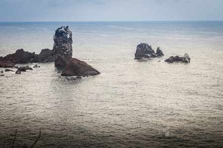 Beautiful landscape view of eopjikoji, located at the end of the eastern shore of Jeju Island. "Seopji" is the old name for the area, and "Koji" is Jeju dialect meaning a sudden bump on land.の写真素材