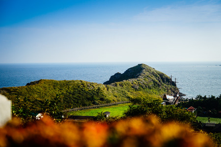 Jeju Island, KOREA - NOVEMBER 12: The tourist visited Sanbanggulsa temple that located on Sanbangsan Mountain. On the way to the cave, with the temple in it you have multiple buildings - 12 NOVEMBER 2016の写真素材