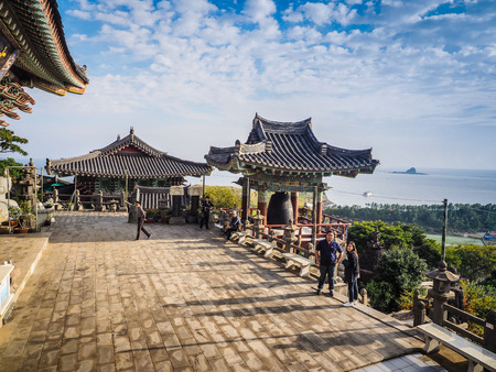 Jeju Island, KOREA - NOVEMBER 12: The tourist visited Sanbanggulsa temple that located on Sanbangsan Mountain. On the way to the cave, with the temple in it you have multiple buildings - 12 NOVEMBER 2016のeditorial素材