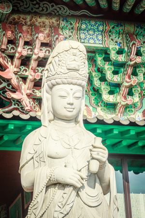 Stone statue of Gwanseeum-bosal at Sanbangsa Temple. Also known as Guanyin or Guanshiyin , is the Goddess of mercy, influenced from Chinese folk religion. Widely worship in the East & South East Asiaの写真素材