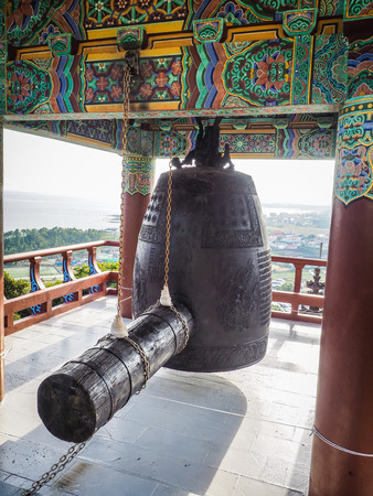 Monastery ring bell at Sanbanggulsa buddhist temple at Sanbangsan of Jeju island Koreaの写真素材