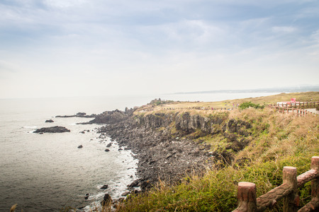 Beautiful landscape view of eopjikoji, located at the end of the eastern shore of Jeju Island. "Seopji" is the old name for the area, and "Koji" is Jeju dialect meaning a sudden bump on land.の写真素材